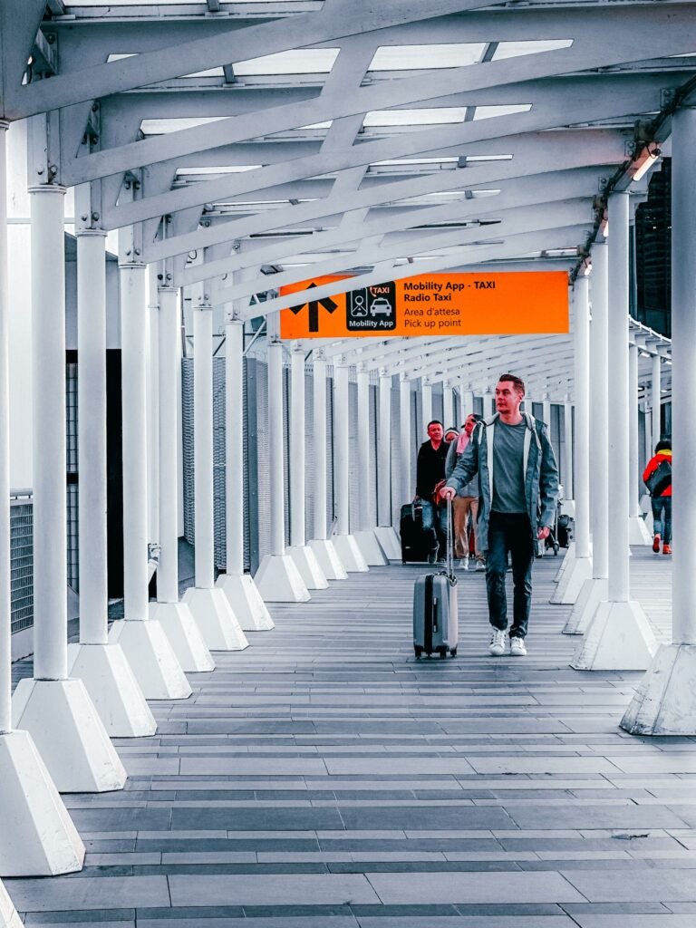 Travellers walking through a modern airport terminal