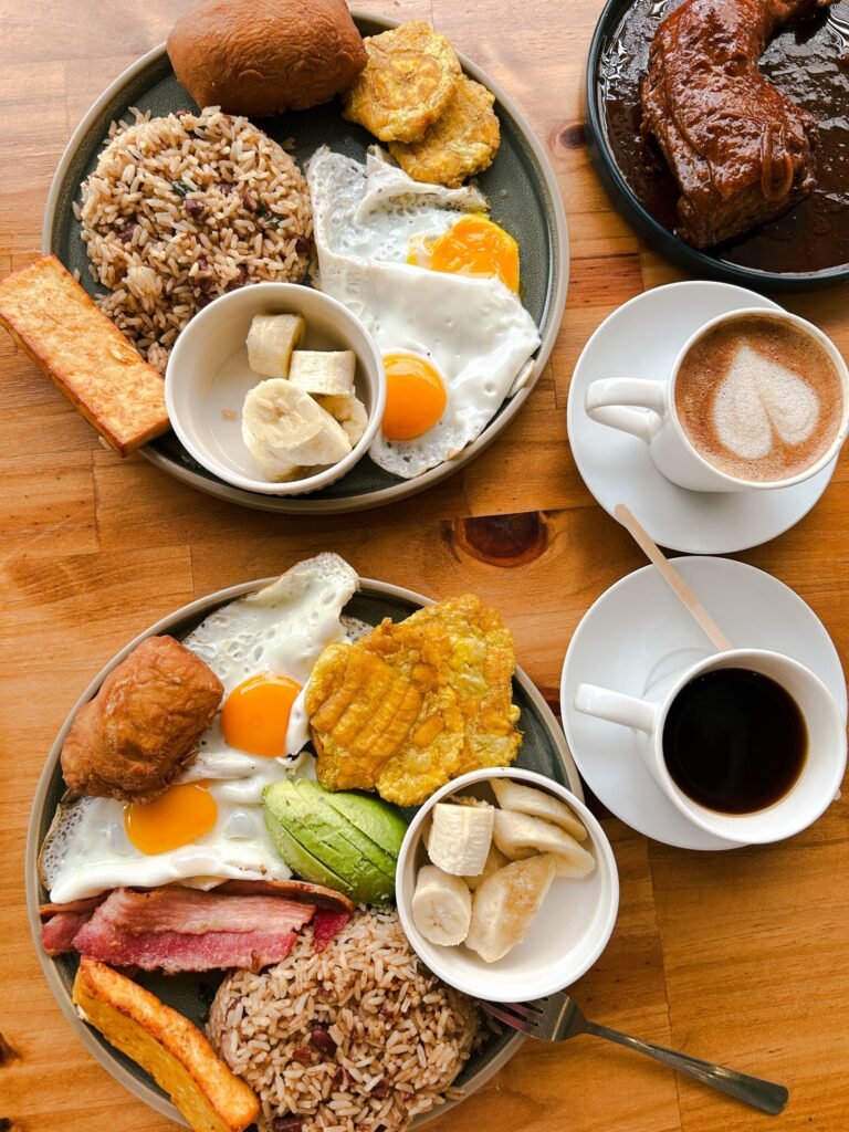 A Colombian breakfast of arepa, eggs, patacón and coffee