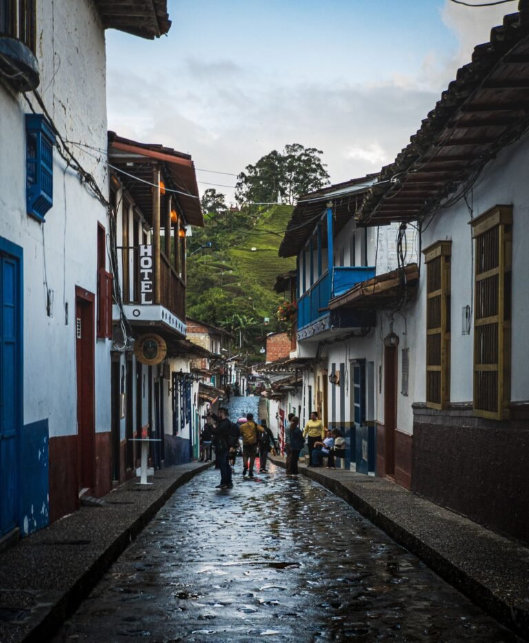 Cobblestone street with colourful colonial buildings in Jardín, Colombia