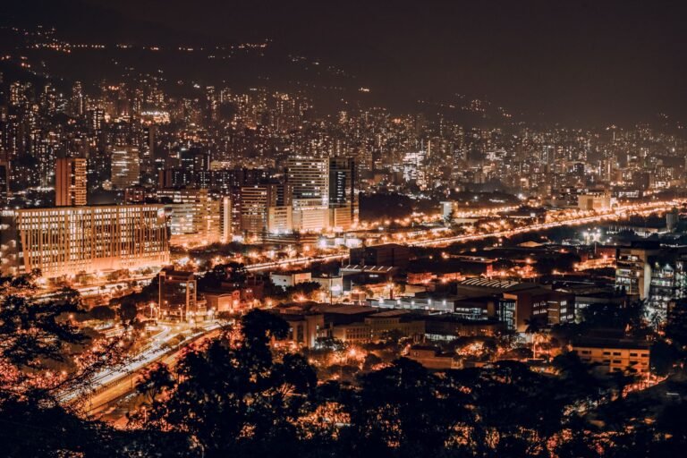 Medellín city lights at night across the valley