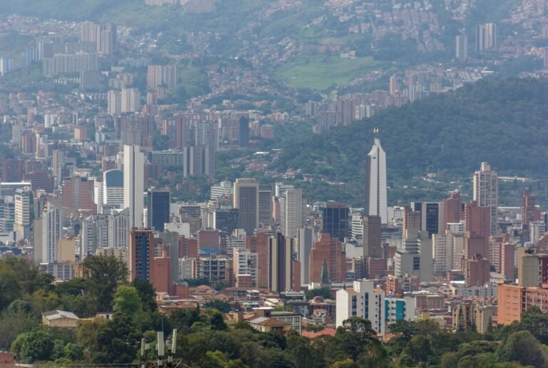 Medellín high-rise buildings surrounded by lush green hills