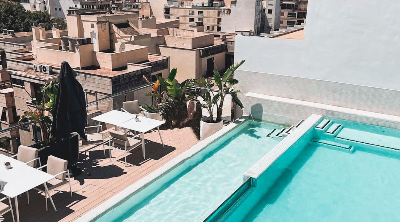 Rooftop terrace swimming pool overlooking a city skyline