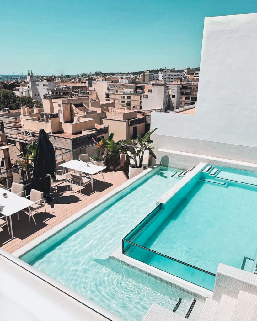 Rooftop terrace swimming pool overlooking a city skyline